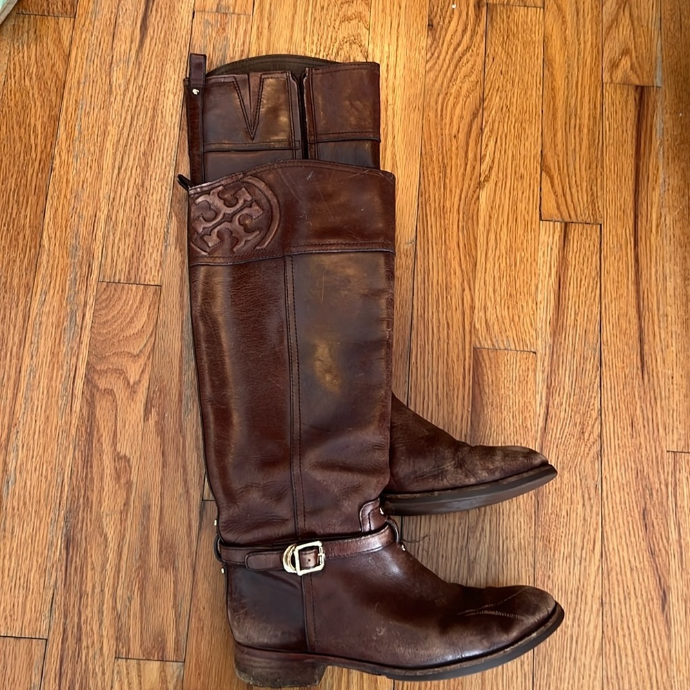 Tory Burch brown leather riding boots.